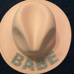 “Babe” pink cowboy hat, flat brimmed. Adjustable head